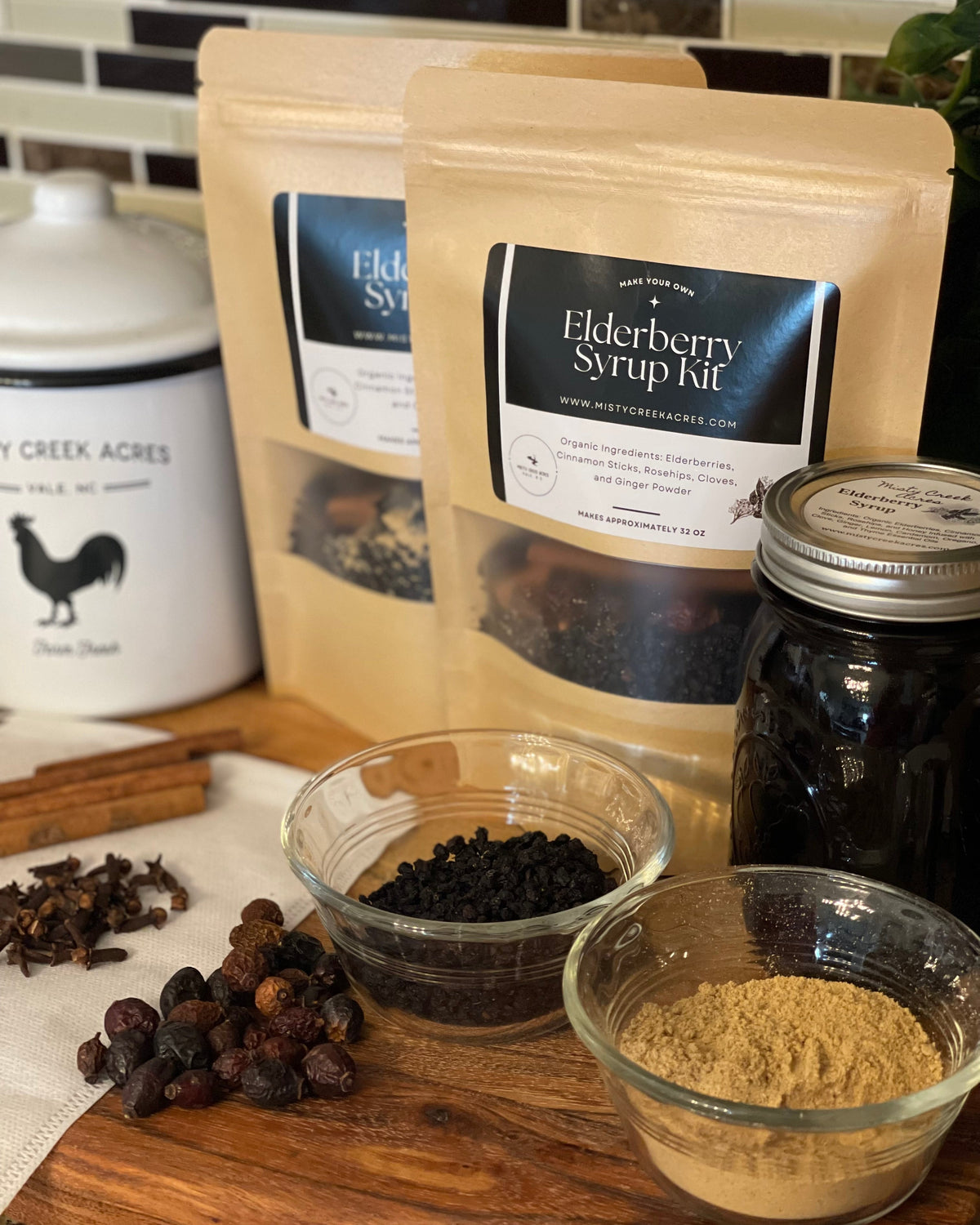 Elderberry syrup kit with ingredients on a wooden surface