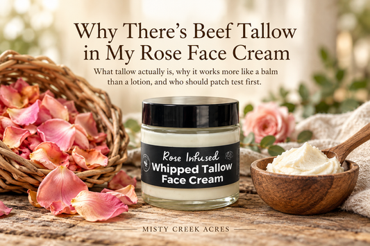 Jar of Misty Creek Acres rose infused whipped tallow face cream beside a basket of dried rose petals and a wooden bowl of whipped tallow