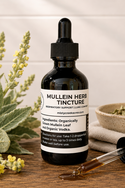 Mullein Herb Tincture bottle with dropper on a wooden surface with plants and a bowl of herbs.