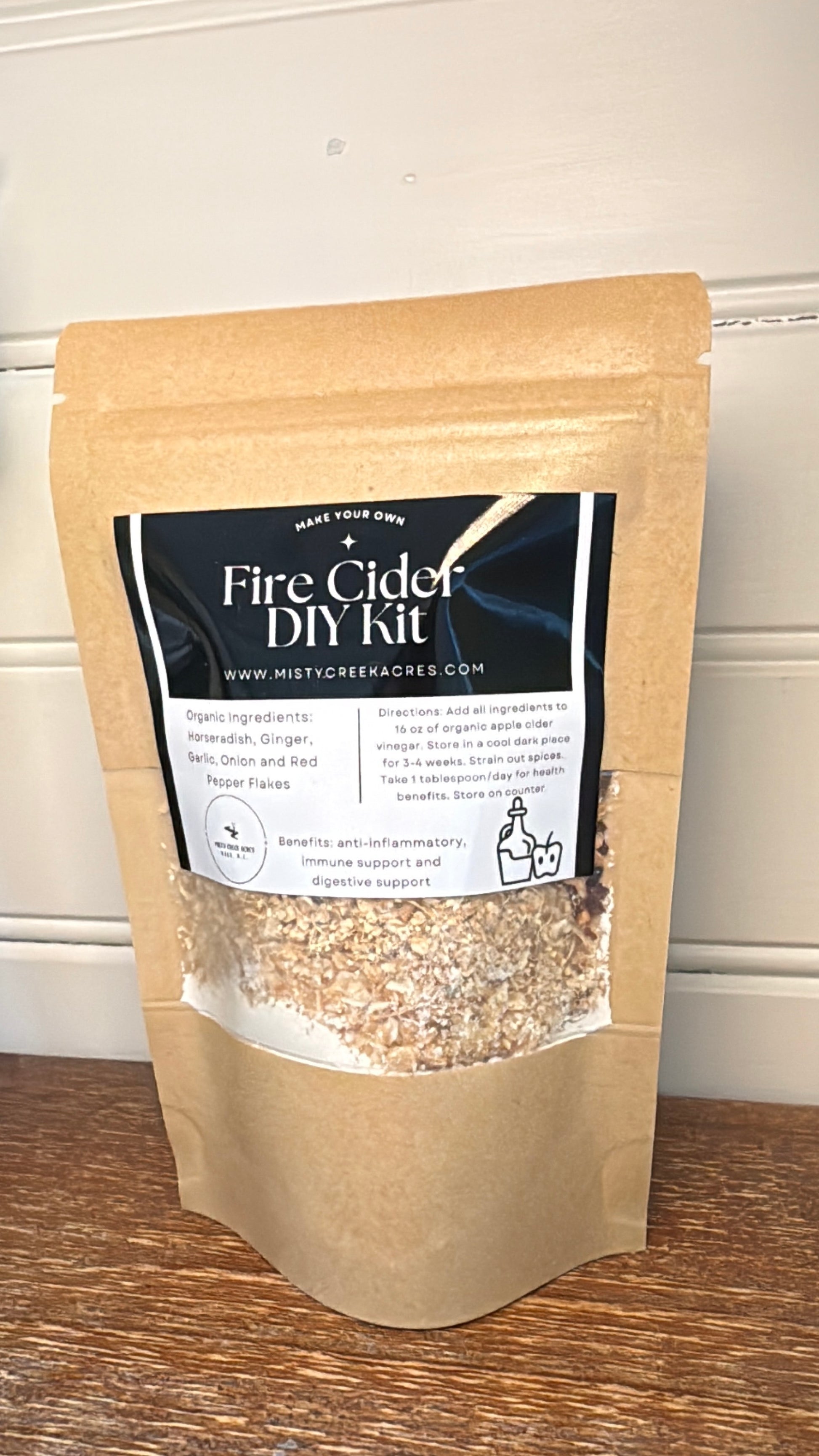 Fire Cider DIY Kit packaging on a wooden surface with a white background