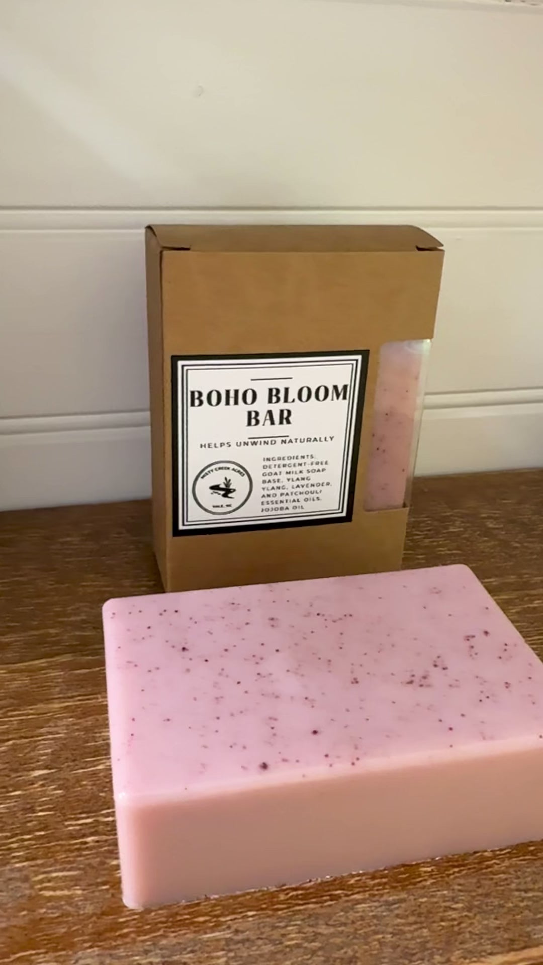 Boxed soap bar with 'Boho Bloom Bar' label on a wooden surface.