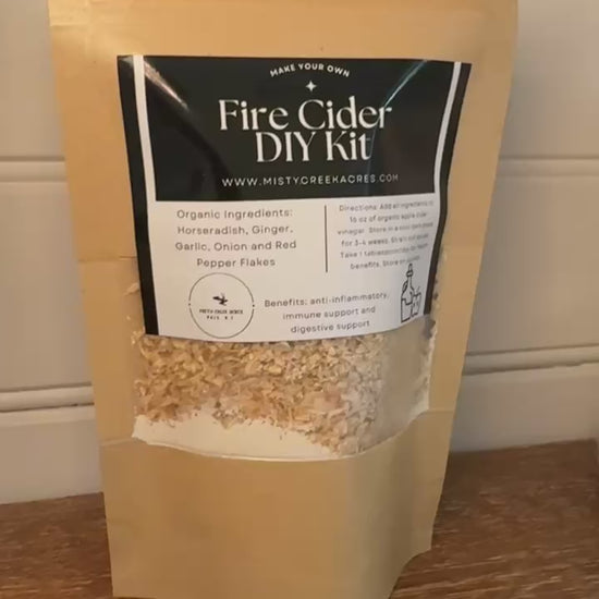 Fire Cider DIY Kit packaging on a wooden surface with a white background